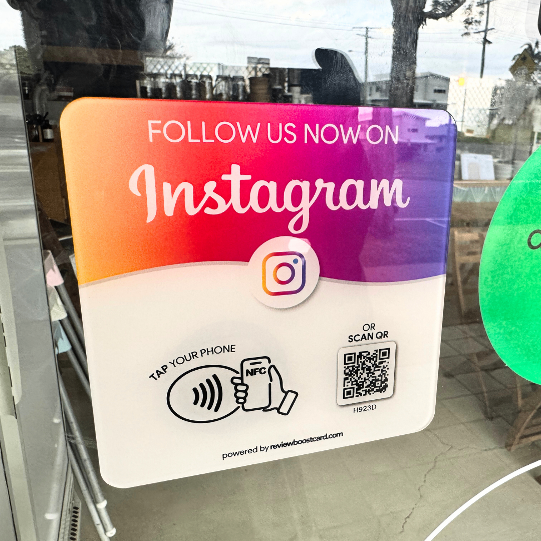 uare plaque with a gradient from orange to purple, featuring the Instagram logo and text 