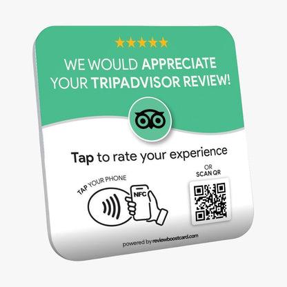 A ReviewBoost plaque requesting a TripAdvisor review. The plaque is green and white with the TripAdvisor logo and text that says, 'We would appreciate your TripAdvisor review! Tap to rate your experience. Tap your phone or scan QR